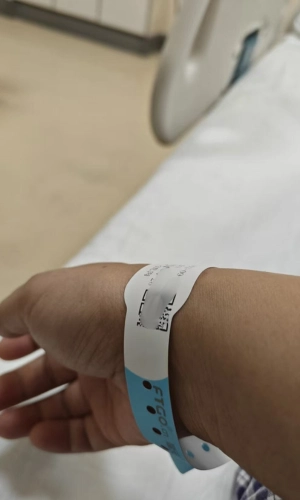Patient wearing a wristband for display 3