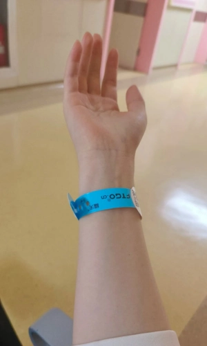 Patient wearing a wristband for display 2