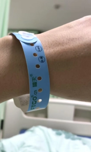 Patient wearing a wristband for display 2